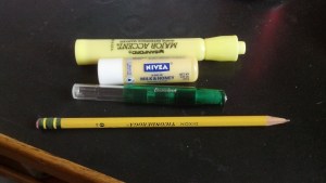 The closed pen with assorted items for scale.