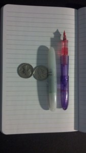 closed pen next to open pen with cap on back.