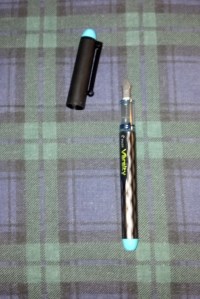 Pilot Varsity Disposable with cap off (turquoise ink)