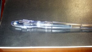 Pilot Penmanship Extra Fine Nib on top of a Moleskine reporter notebook