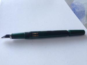 To fill, you unscrew the back while it is dipped in ink. 